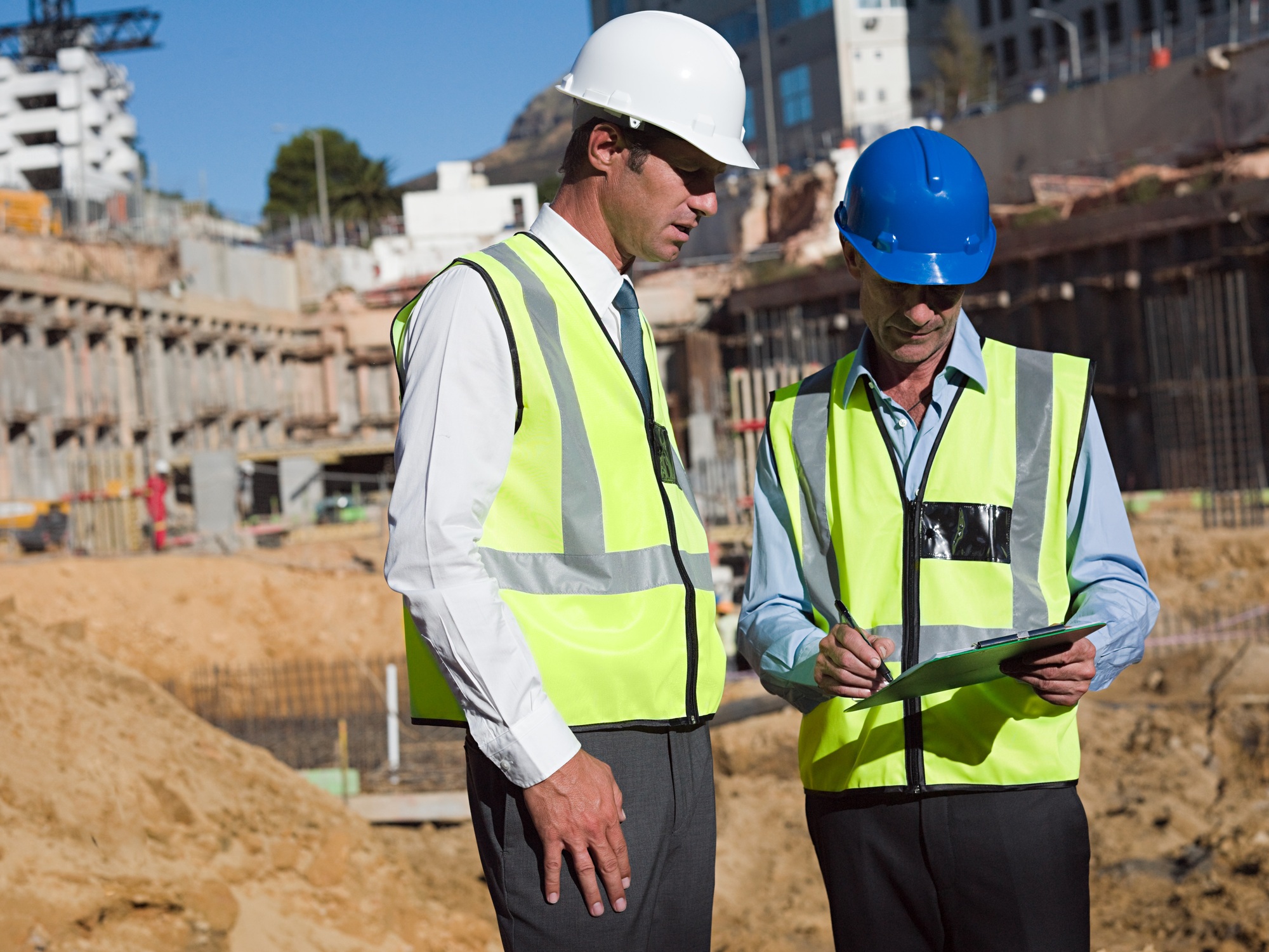 Mature men meeting on construction site